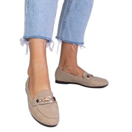 Brown loafers with a matte finish with a golden decoration