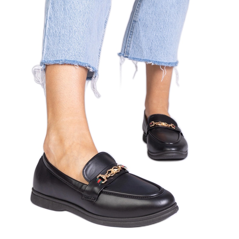 Black loafers with gold decoration