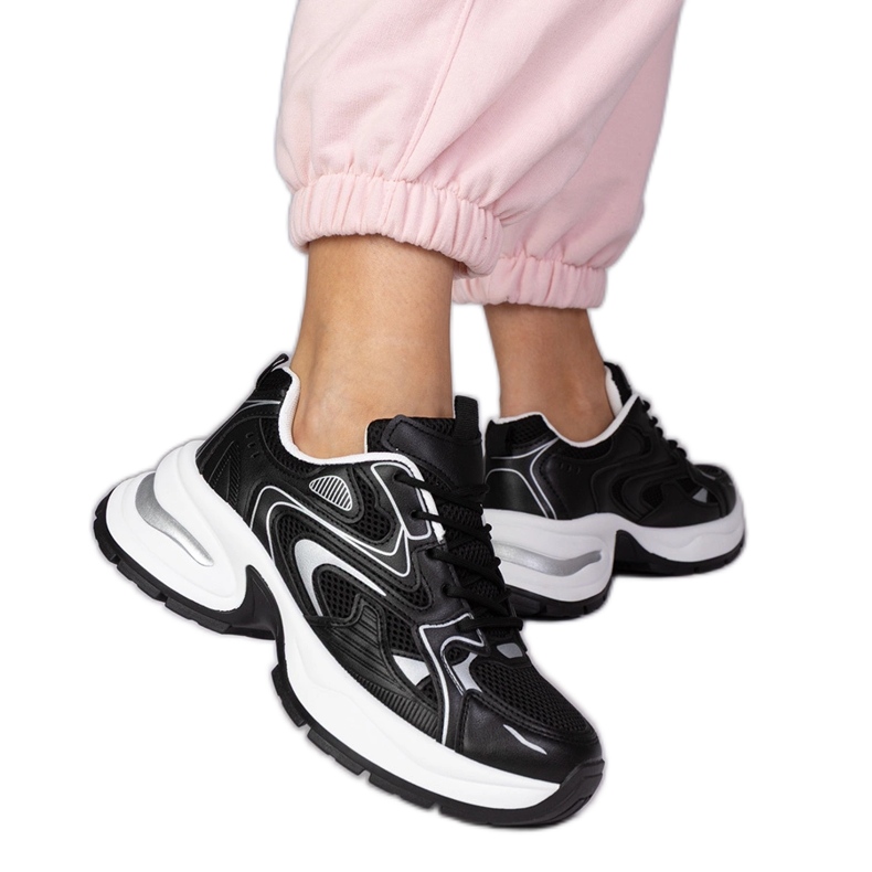 Black sports sneakers on a thick sole