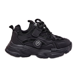 Children's sneakers on the black platform