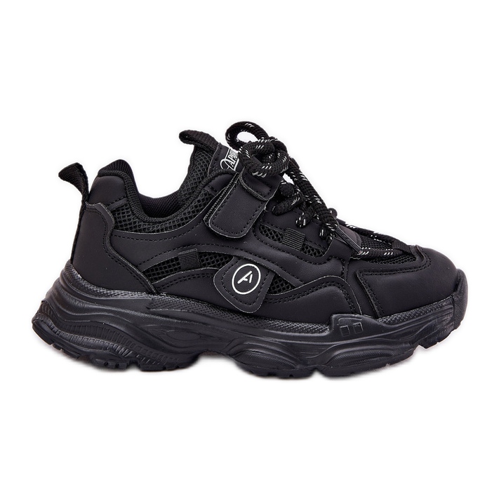 Children's sneakers on the black platform