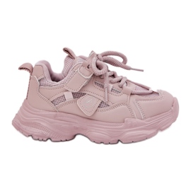 Children's sneakers on the pink platform