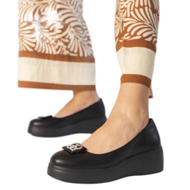 Black shoes on the platform with a zircon decoration Black shoes on the platform with a zircon decoration