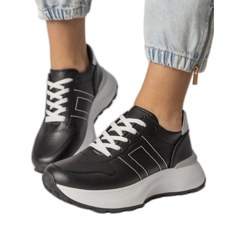 Black sports sneakers with a silver insert