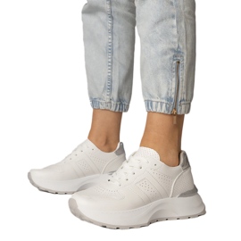 White sports sneakers with a silver insert