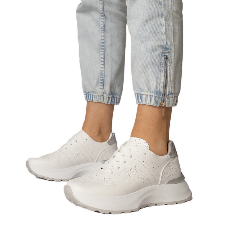 White sports sneakers with a silver insert White sports sneakers with a silver insert