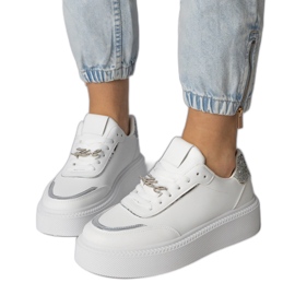 White and silver sneakers decorated with glitter and zircons
