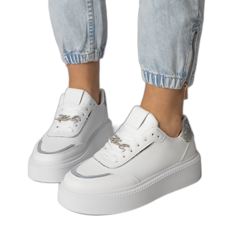 White and silver sneakers decorated with glitter and zircons