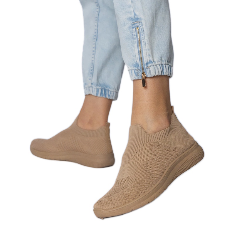 Beige sports sneakers with a socking upper