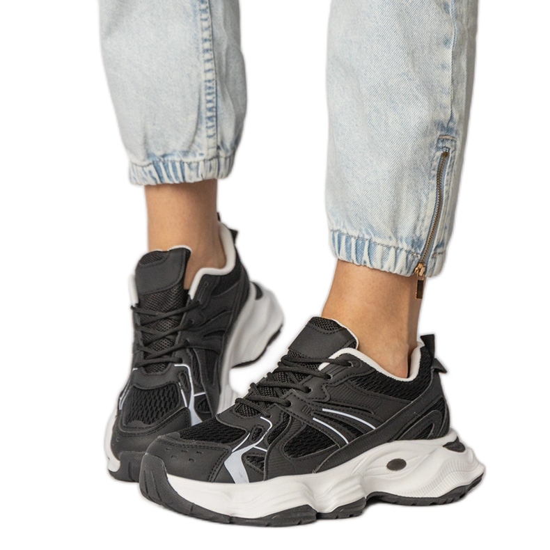 Black sports sneakers on a massive sole