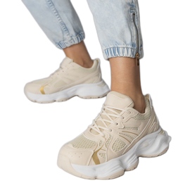 Beige sports sneakers on a massive sole Beige sports sneakers on a massive sole