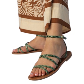Green sandals on a flat sole