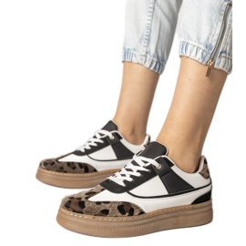 Black and white sneakers with a leopard accessory Black and white sneakers with a leopard accessory