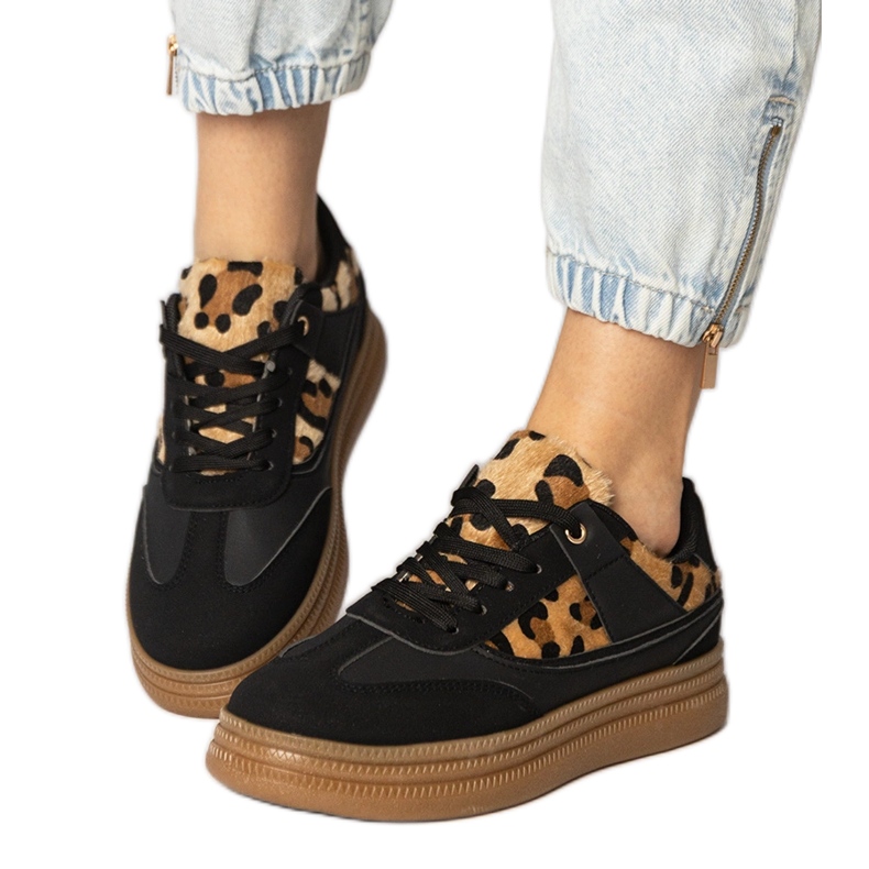 Black sneakers with a leopard accessory