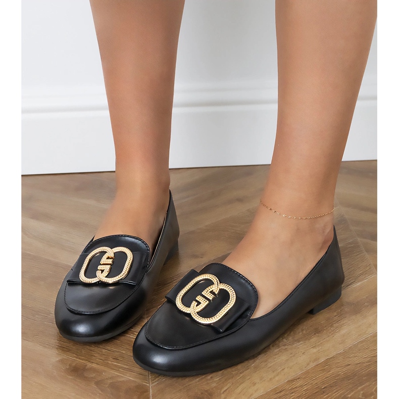 Black women's loafers with a golden decoration Black women's loafers with a golden decoration