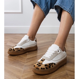 White sneakers with a leopard accessory White sneakers with a leopard accessory
