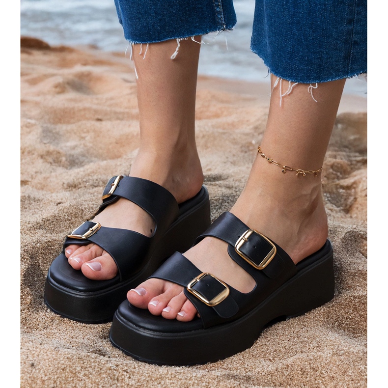 Black flip flops with clamps on stripes