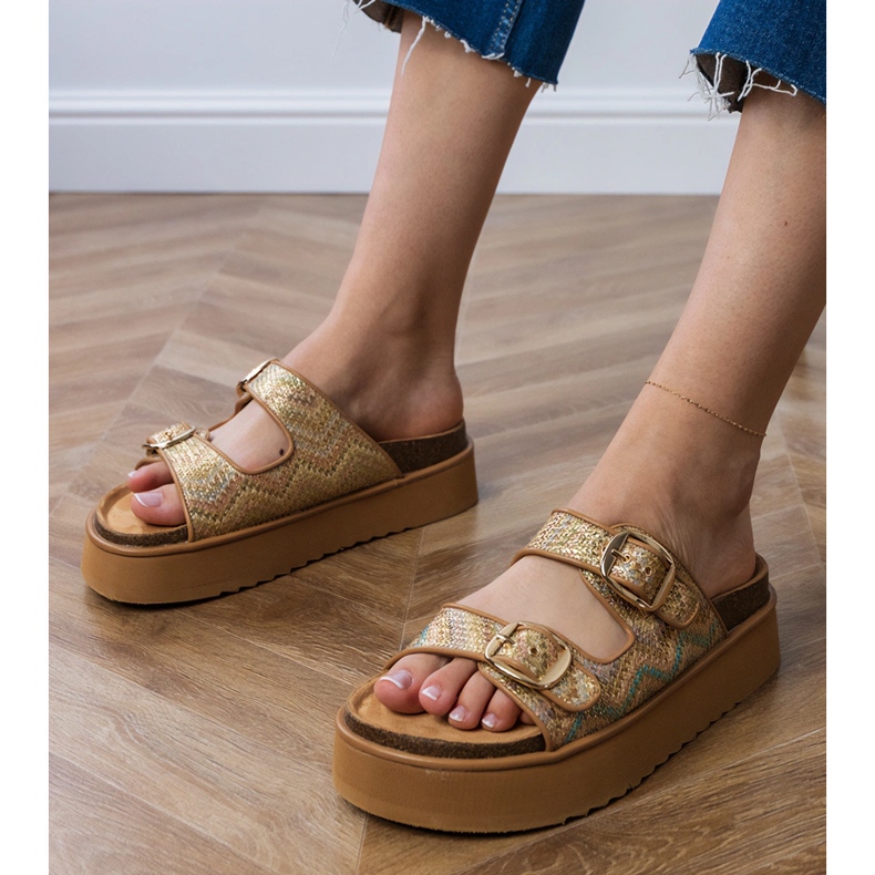Golden flip flops with clamps on stripes