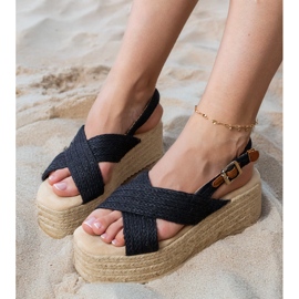 Black espadrilles sandals on the platform with stripes