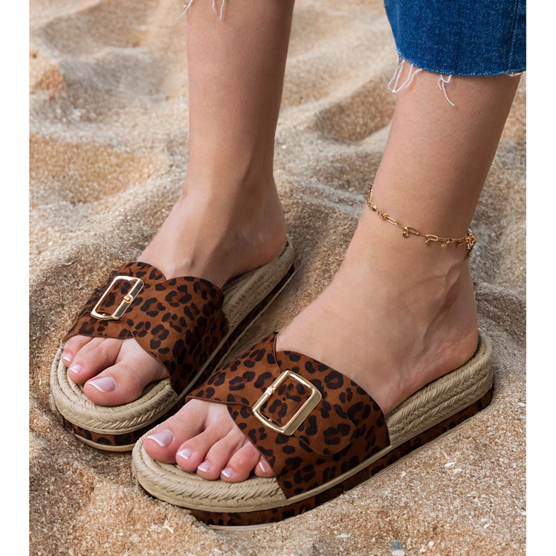 Panther flip flops on the platform with a buckle on the bar brown