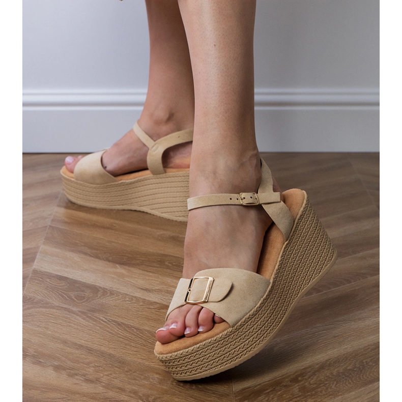 Brown women's sandals with a decorative buckle