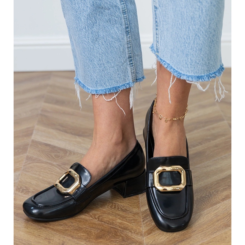 Black women's low -heeled shoes with a golden decoration