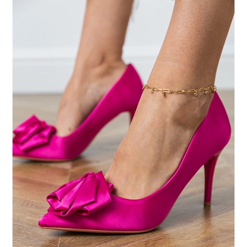 Pink satin pumps with a flower