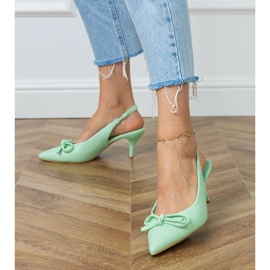 Green pumps with low heels with a bow