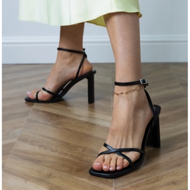 Black sandals with stripes fastened with ankle Black sandals with stripes fastened with ankle