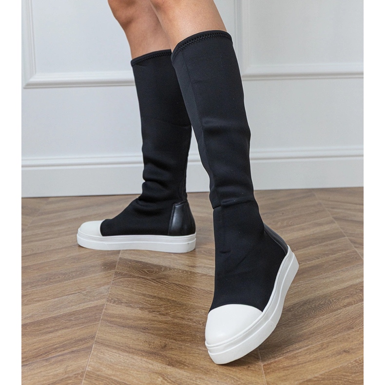 Black material sports boots with an elastic upper