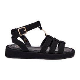 Women's sandals on the platform with a golden detail black