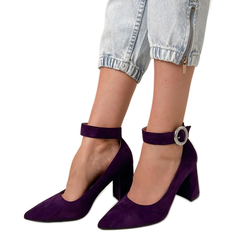 Purple pumps on the post with a buckle and zircons violet