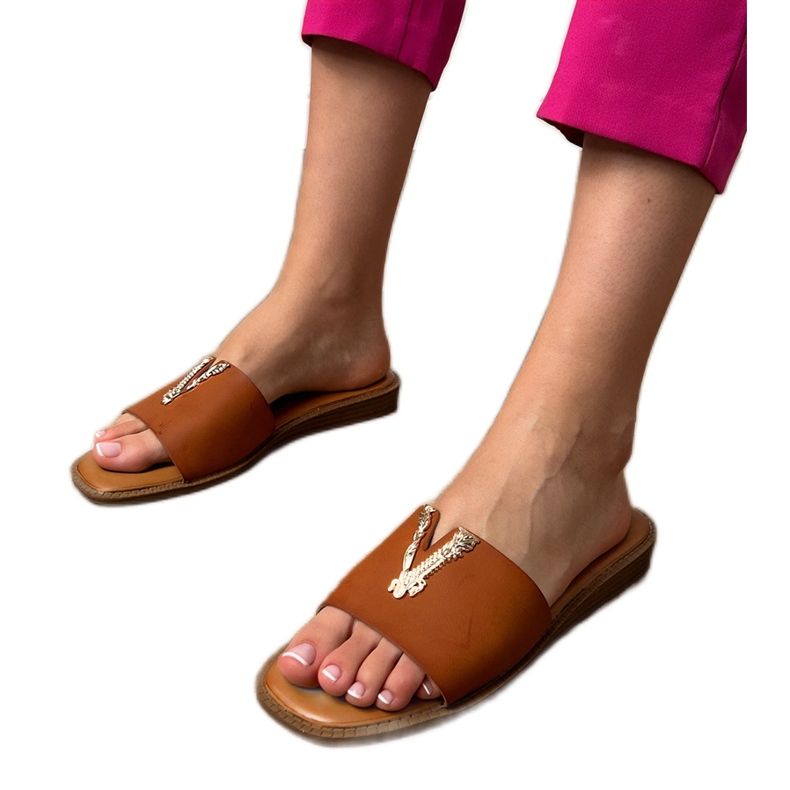 Brown flip -flops with a golden decoration Brown flip -flops with a golden decoration