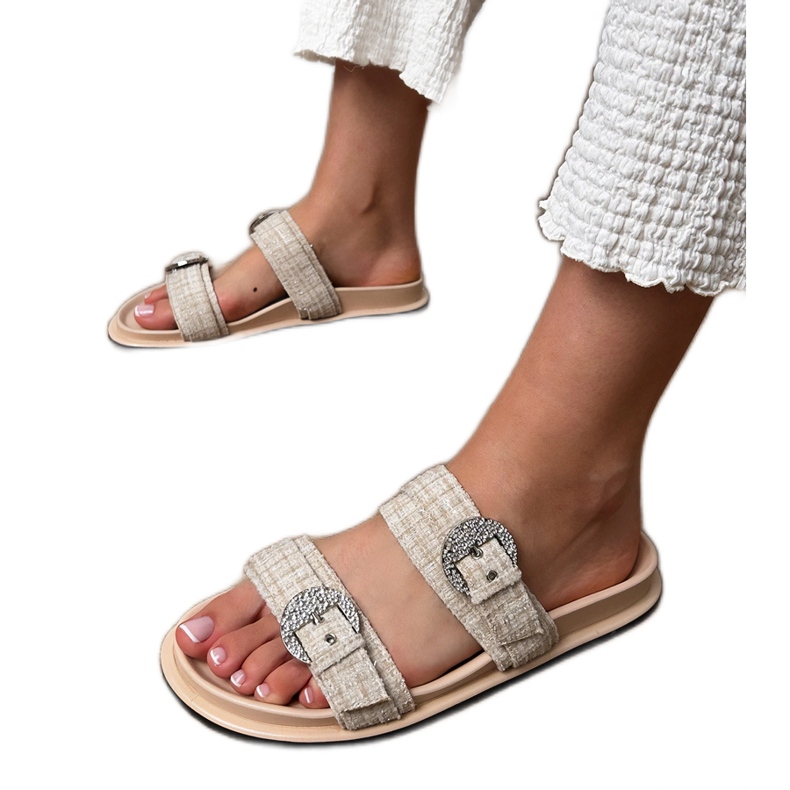 Beige flip flops with stripes and zircons on the clamps