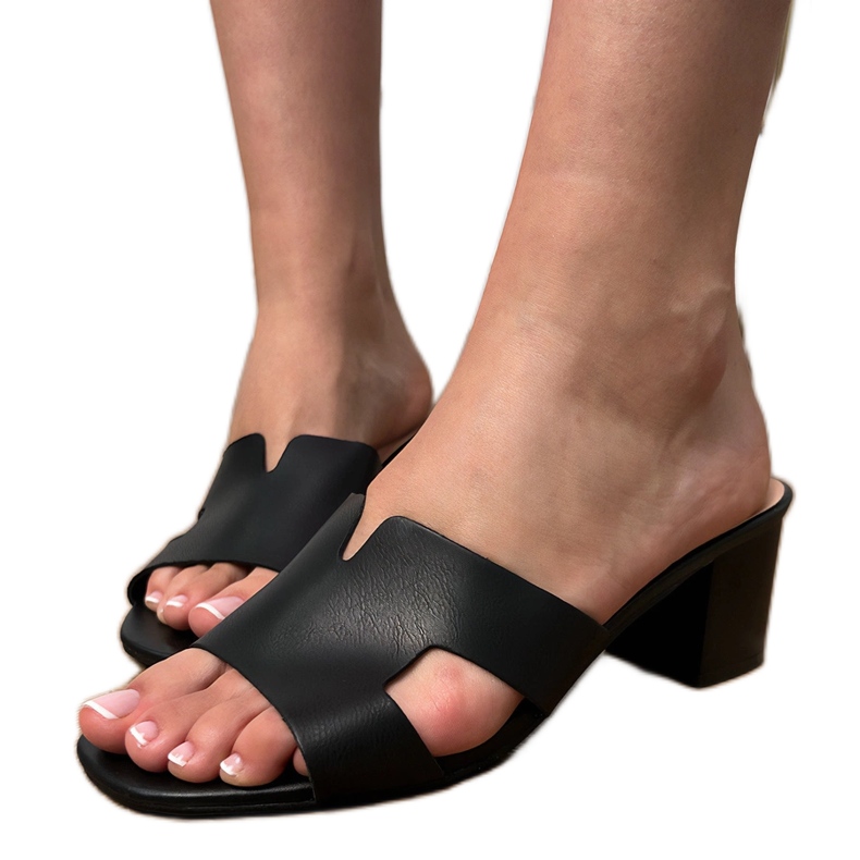 Black flip flops on the pillar with cutouts on the belt