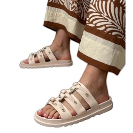Beige Roman flip flops with studs