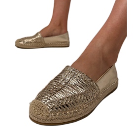 Openwork espadrilles on the platform golden