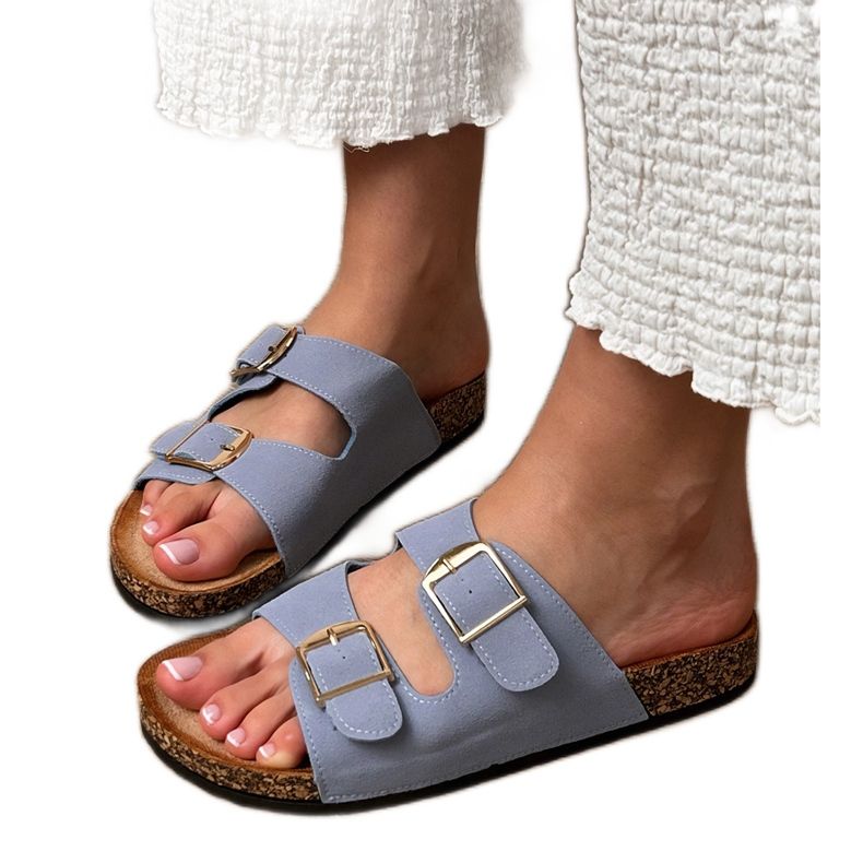 Blue flip flops with clamps on a cork sole