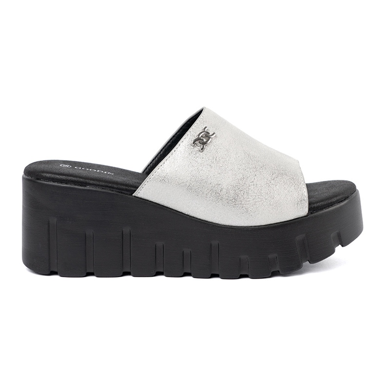 Goodin Silver flip flops on a black platform