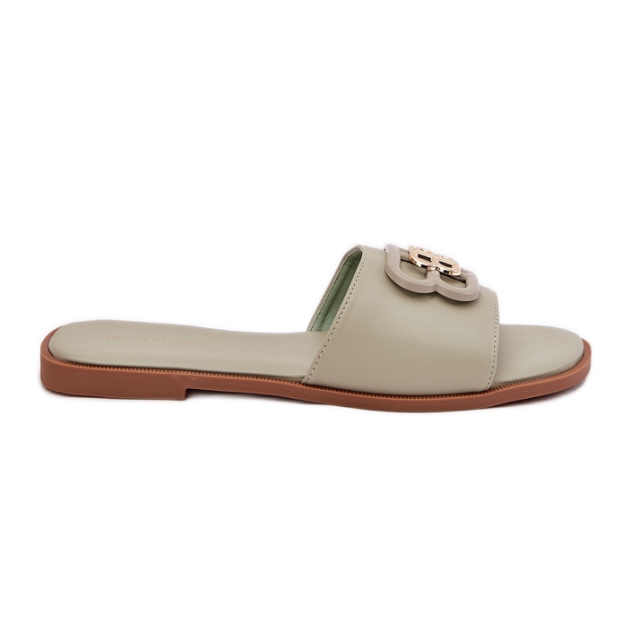 Flat women's flip flops with a decorative green detail Flat women's flip flops with a decorative green detail