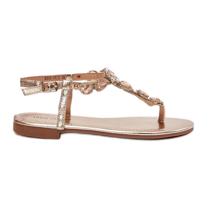 Flat -heeled women's sandals with golden crystals