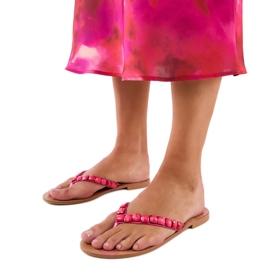 Pink flip flops decorated with pebbles