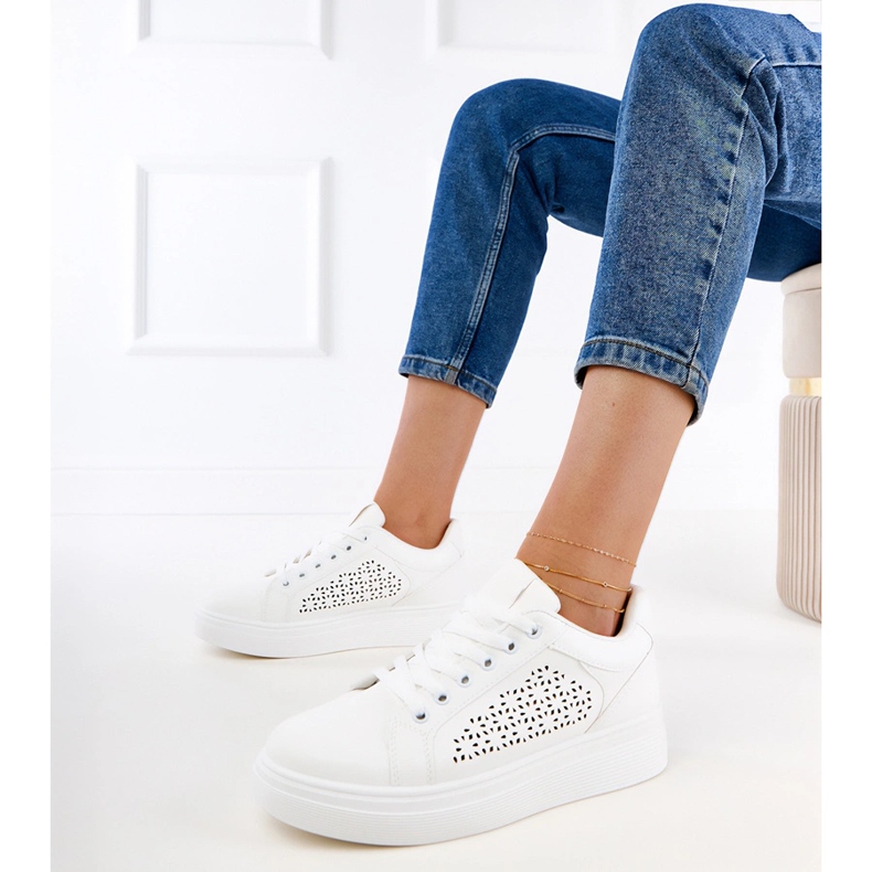 White sneakers on the platform