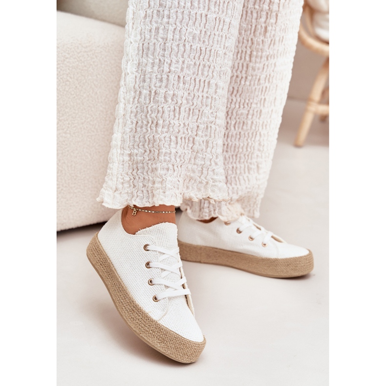 Women's sneakers on the platform with white braid