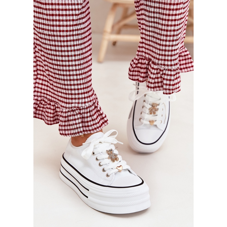 Women's sneakers on the platform with golden pins white