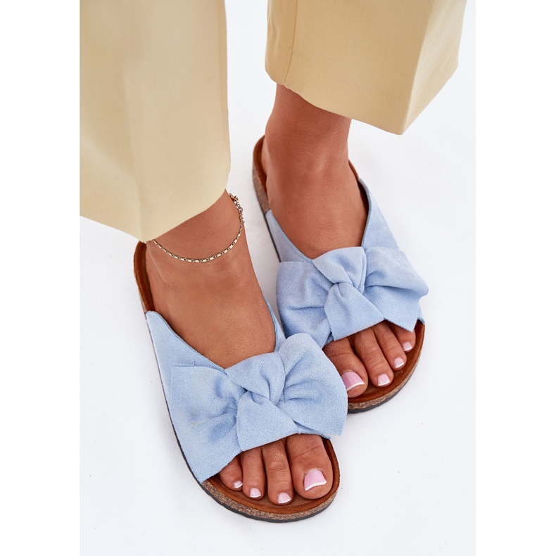Women's flip flops on the cork sole with a blue bow Women's flip flops on the cork sole with a blue bow