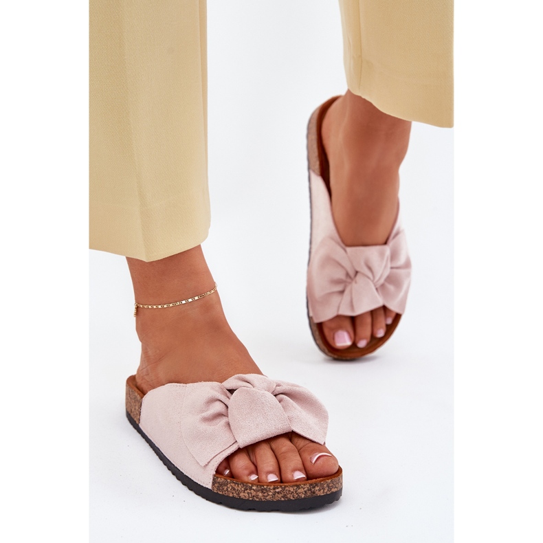 Women's flip flops on the cork sole with a light pink bow