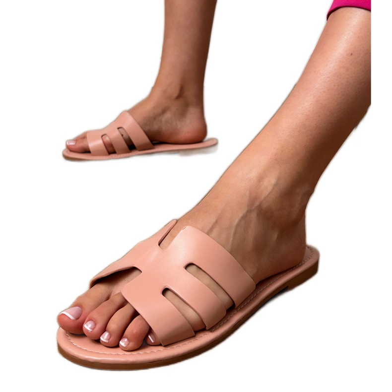 Pink flip -flops decorated with cutouts Pink flip -flops decorated with cutouts