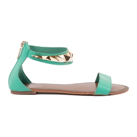 Green sandals with an ankle belt with a golden decoration