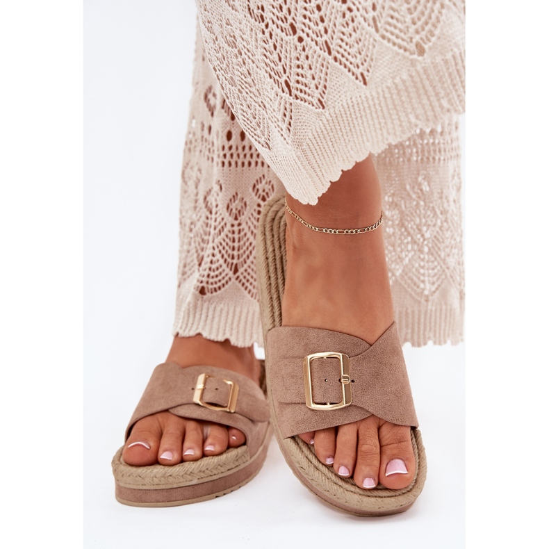 Women's flip flops on the platform with a golden clamp dark beige